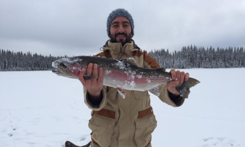 A Fisherman Holding His Catch