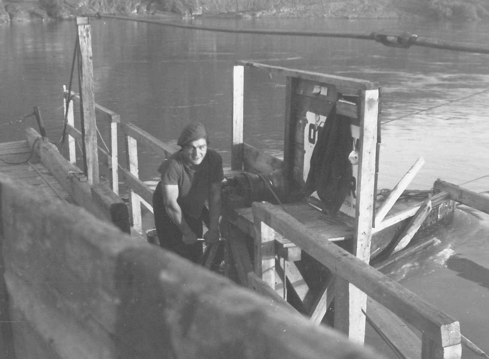 This fellow appears to be the ferry operator on the second edition of the Fort Vermilion ferry This ferry operated just downriver from where the bridge stands today - the first edition crossed the River opposite the Old Bay House. He appears to be cranking on a lever that winds up the end board of the ferry to prevent wagons and trucks from rolling off. The photo was taken by Gwyn Bailey Cook who was the teacher at Lambert point school for the 1948 school year!
990.4.3.49 / Gwyn Bailey Cook