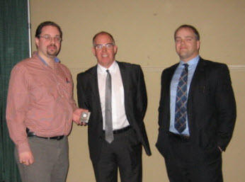 Chapter President Kevin Clannon (L) thanks Steve Morrison and David Schofield of National Bank following their presentation at the February Chapter meeting