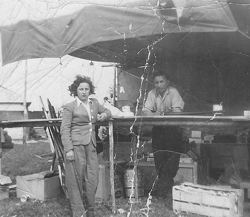 These two are unknown and appear to be standing in front of a temporary kitchen of sorts. If you recognize either of them (or have ideas about where they may be) let us know!
2017.42.08 / Lizotte, Maria

*EDIT*

This is believed to be John and Helen Lizotte.