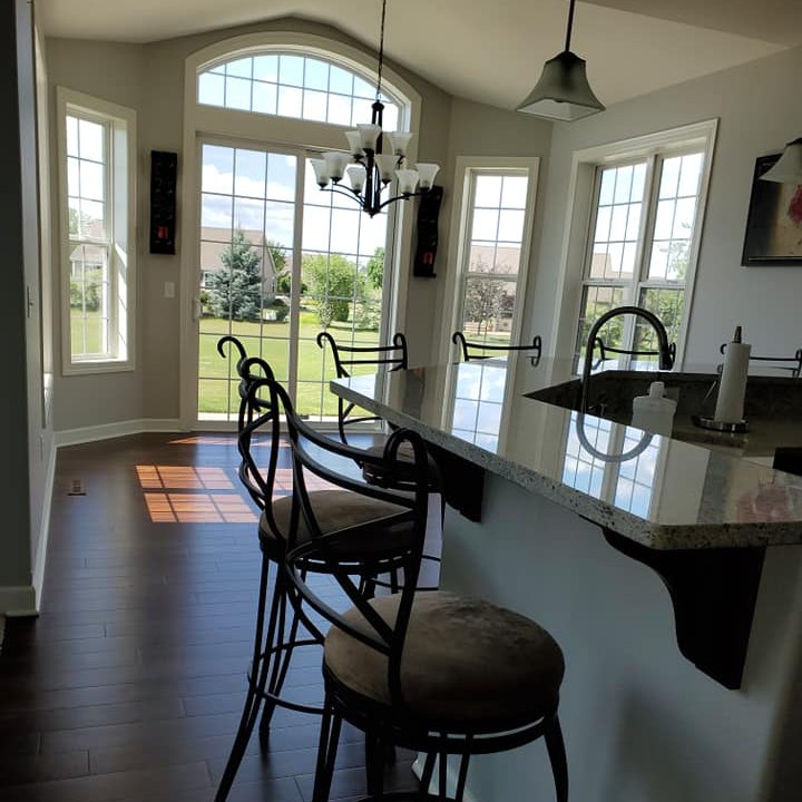 Kitchen and dining environment maintained through ongoing home care with clean surfaces and supported continuity