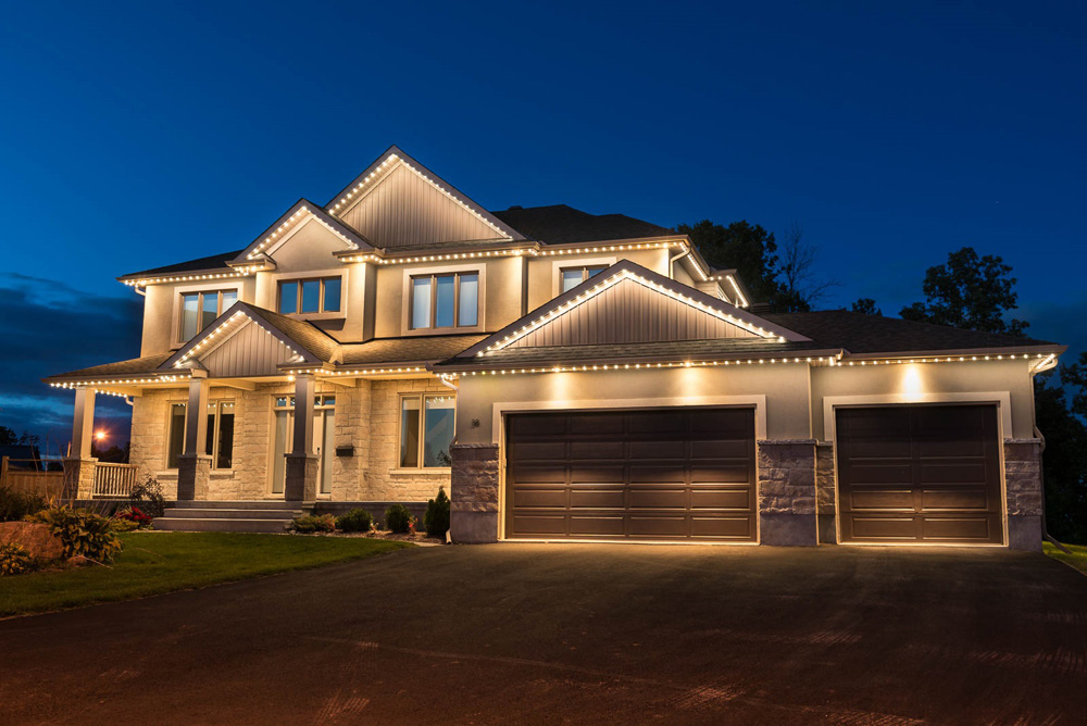 House lit in white lights.