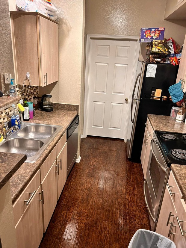 Kitchen restored following neglected property recovery with clutter removed and the environment returned to improved functional condition