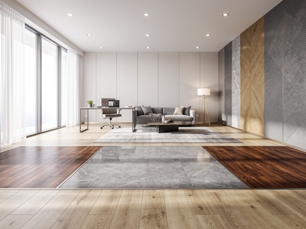 Modern living room with home office, gray sofa, floor lamp, large windows, and mixed wood and marble flooring