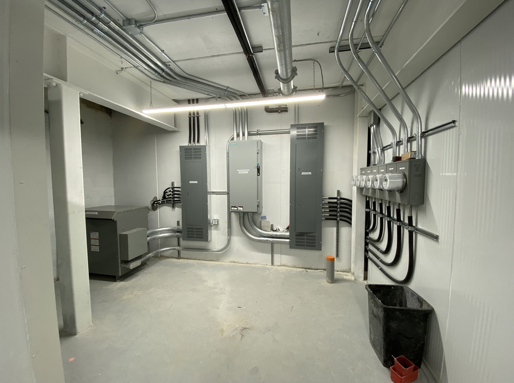 Many electrical boxes inside of a room