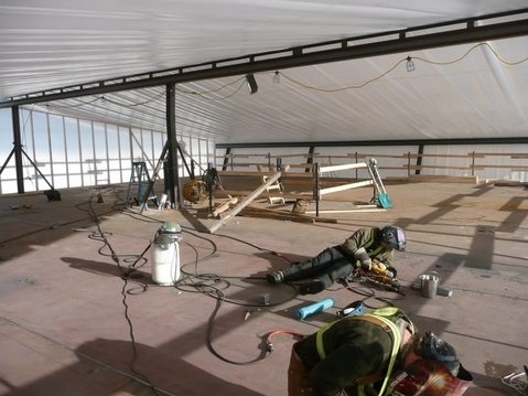 Welding the seams on the car deck.