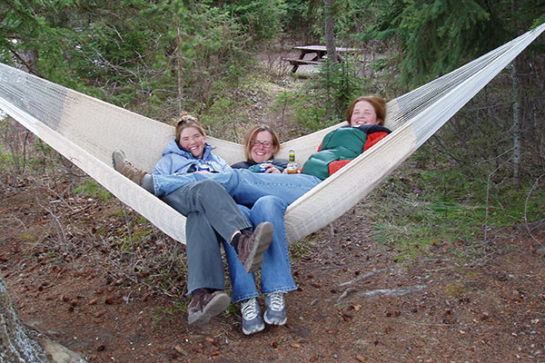 Friends Relaxing on a Hammock Friends Relaxing on a Hammock