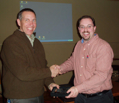 Chapter President Kevin Clannon (R) presents Eben Creaser with a token of the Chapter’s appreciation following Mr Creaser’s presentation at the January meeting