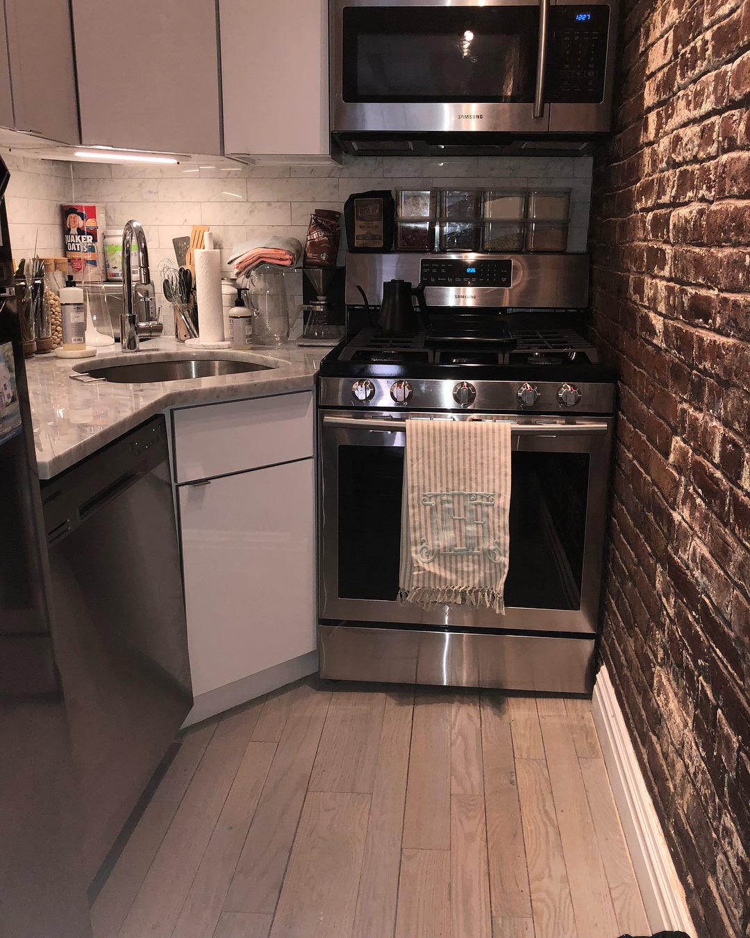 Kitchen maintained through recurring home care with organized surfaces and supported environmental continuity
