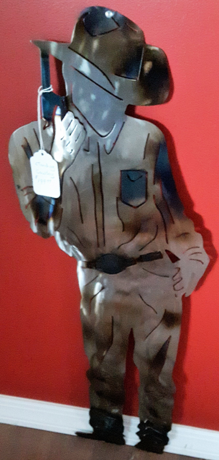 Metal art, Cowboy with pistol, Campbell river BC, Vancouver island BC, Vancouver BC, Victoria BC, British Columbia,Alberta