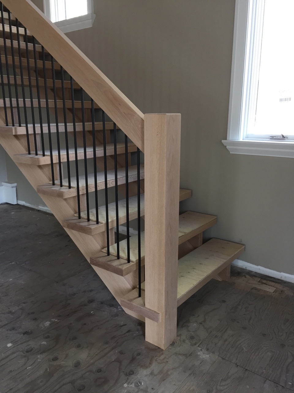 Straight red oak Scandinavian style stairs