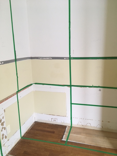 The desk and entire office were laid out on the wall in tape.