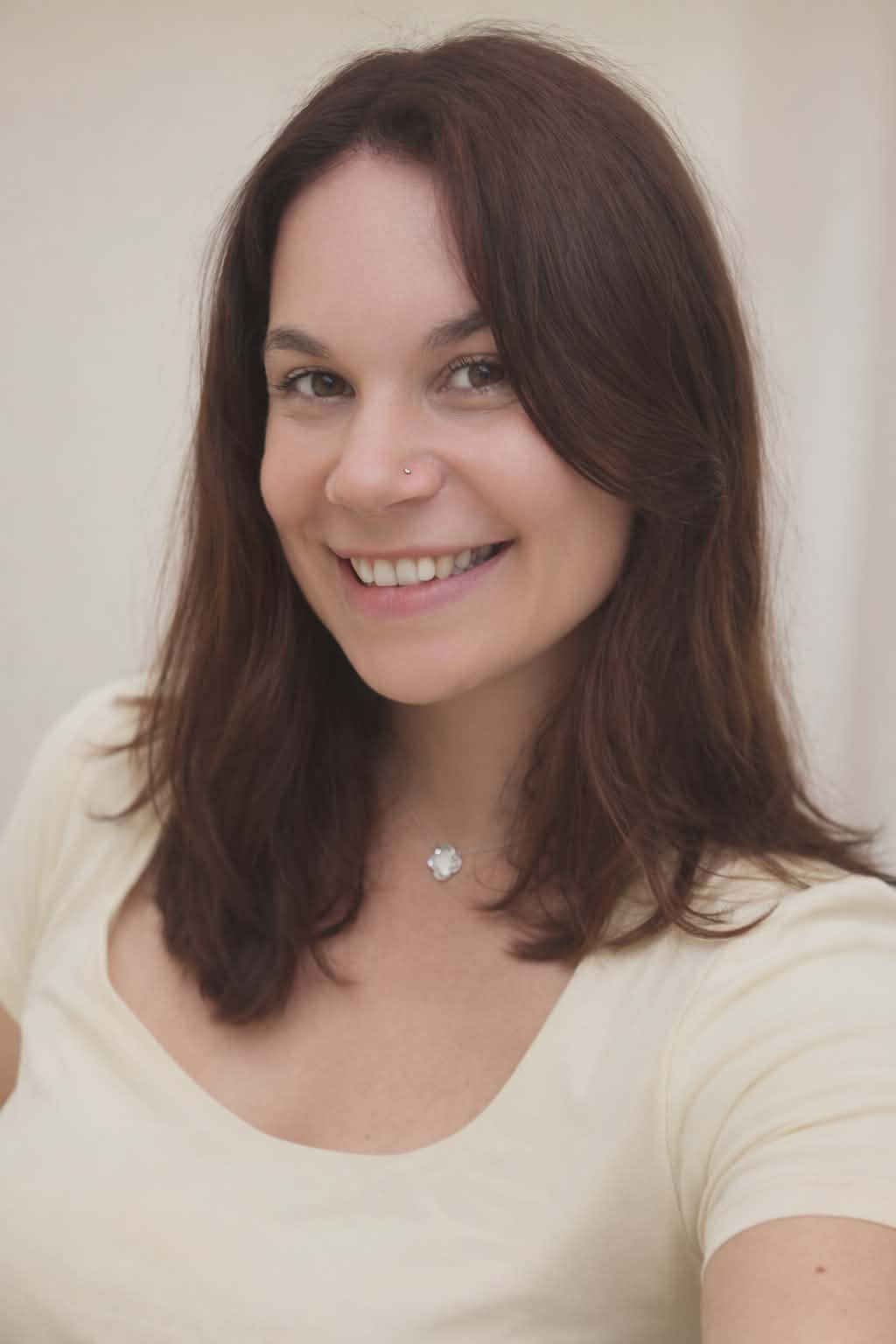 Happy corgi puppy sitting on a polished wooden floor in a modern living room with soft lighting and minimalist decor. Happy corgi puppy sitting on a polished wooden floor in a modern living room with soft lighting and minimalist decor.