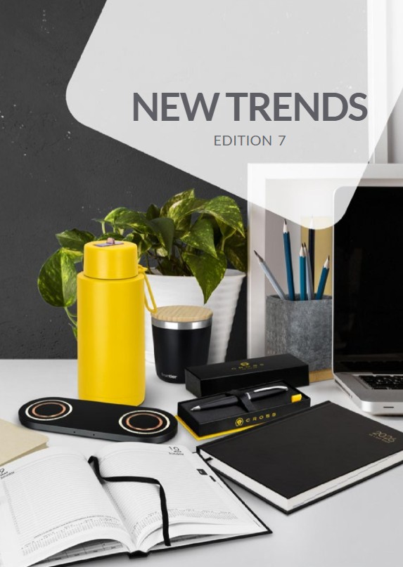Smiling barista holding a coffee cup in a modern cafe with a stylish interior.