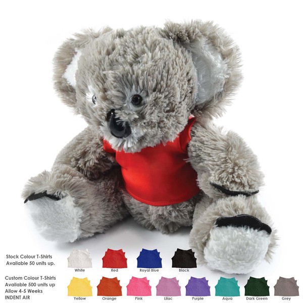 Group of smiling healthcare professionals in blue scrubs standing together in a modern clinic.