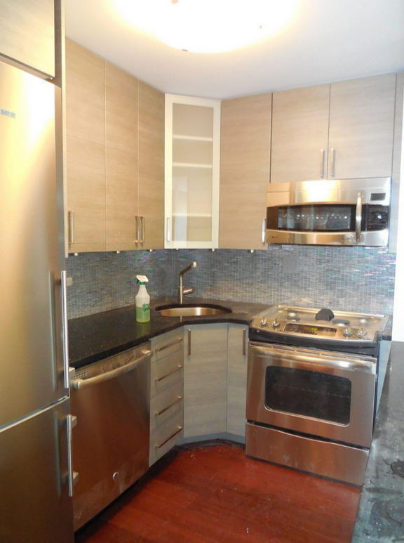 Kitchen in active post-renovation condition with construction dust, residue, and surfaces awaiting recovery preparation