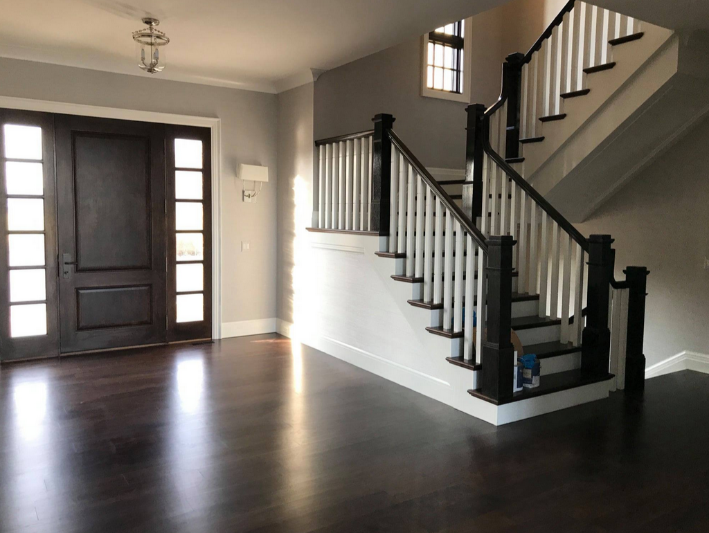 Residential entryway restored following post-renovation recovery with surfaces cleaned and the environment prepared for occupancy