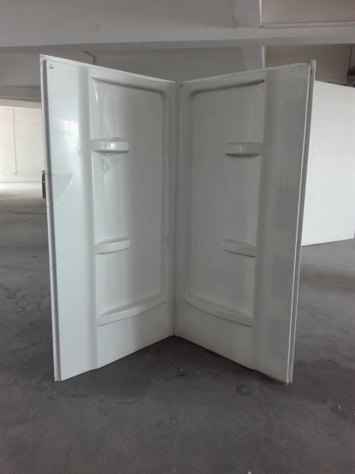 Modern bathroom with freestanding bathtub, large window, light gray tiles, double sink vanity, and decorative plants.