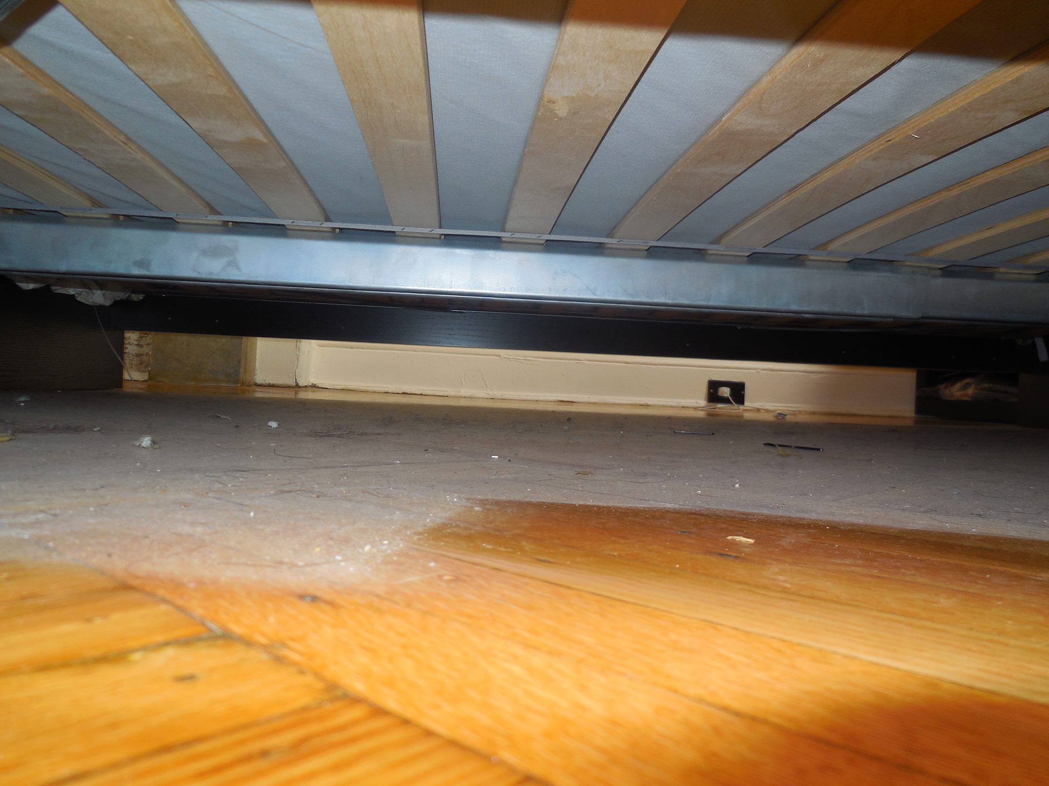 Deep cleaning Toronto – under bed before Deep Clean Reset showing accumulated dust and neglected hidden surfaces