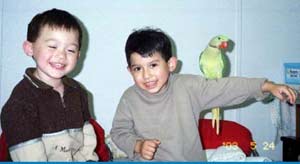 Asanee meets a baby Alex
*Note: The "downtown" stores'
founding "TIKI" Alexandrine was from
JUST for BIRDS - a cousin to this guy.