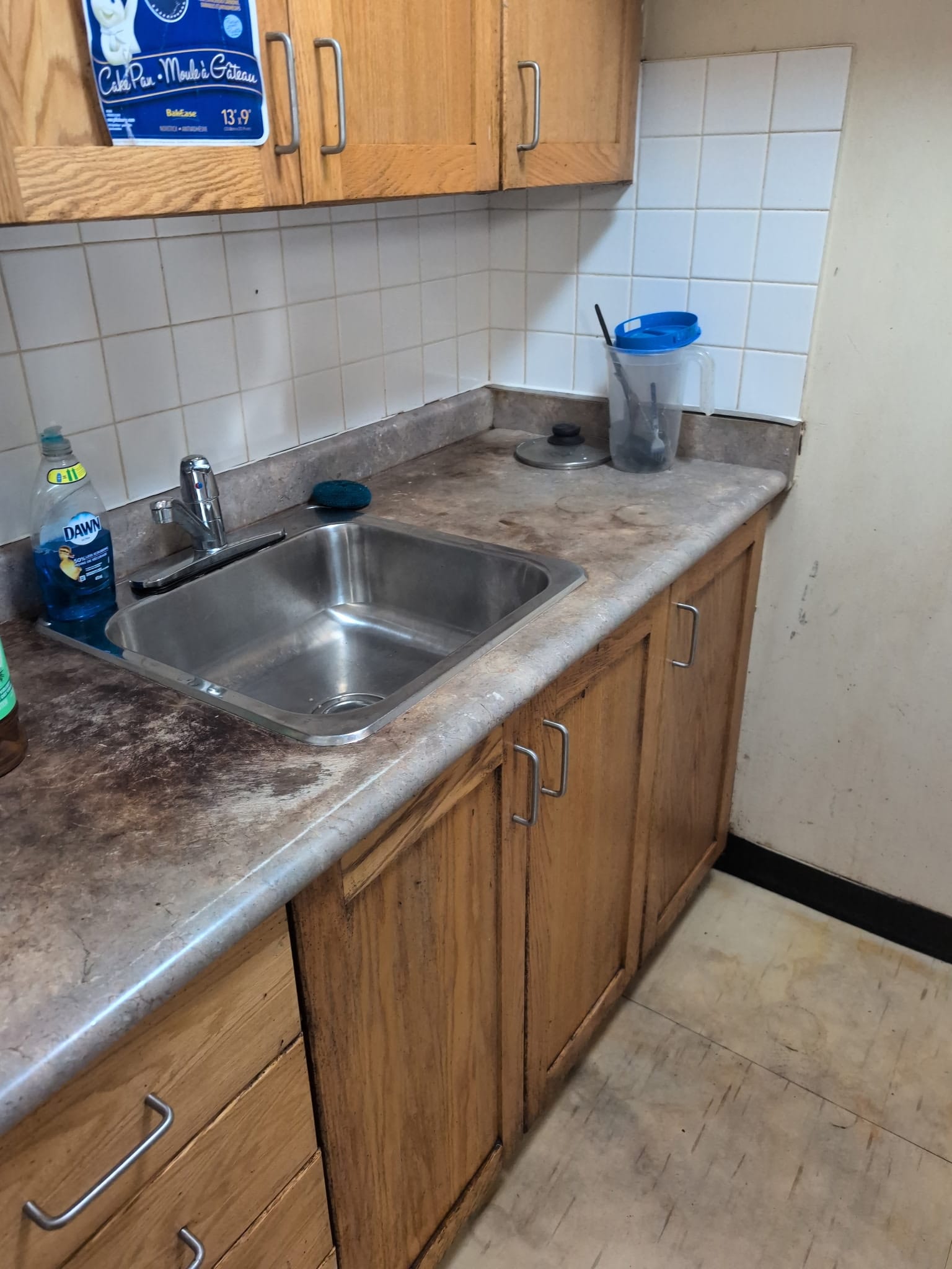 Kitchen improved following neglected property restoration with buildup reduced and the environment returned to improved functional condition