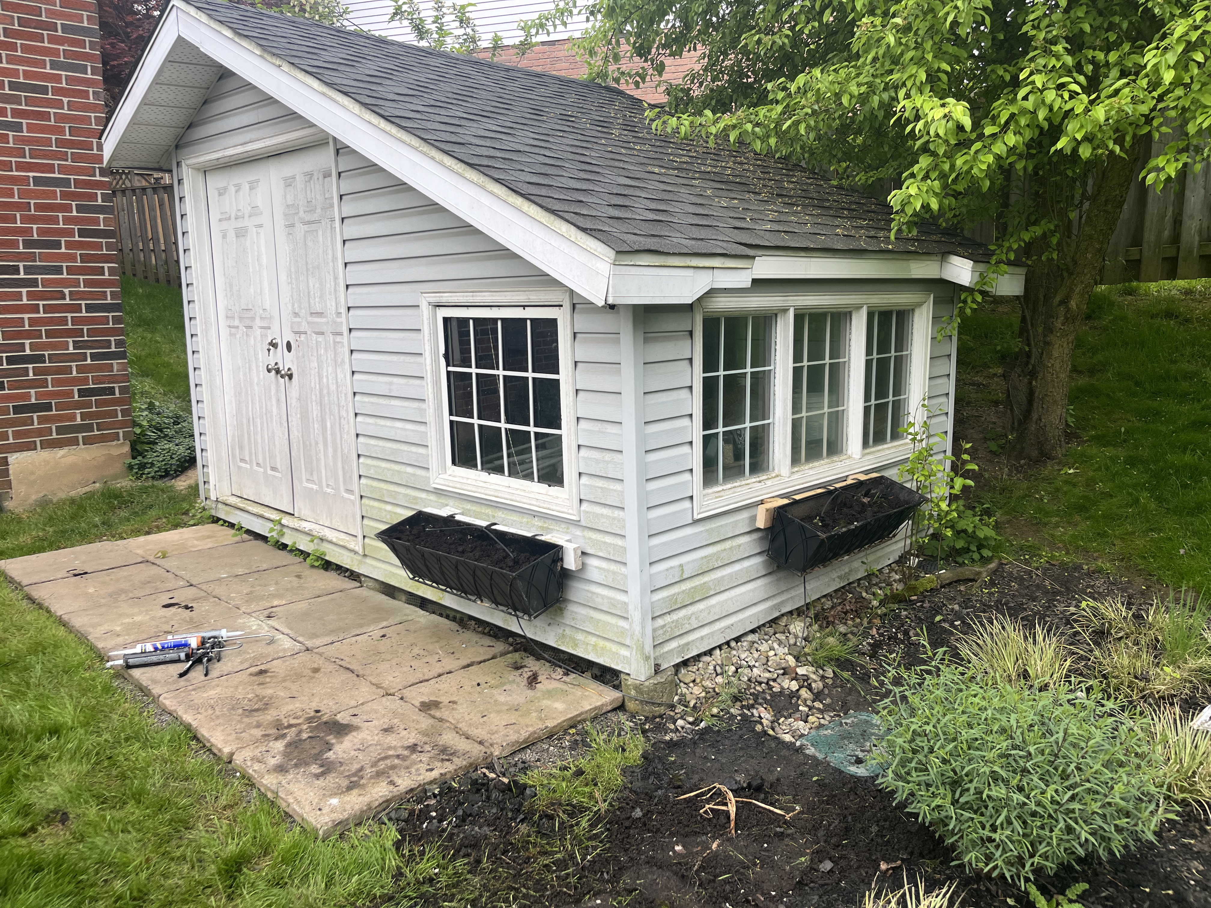 A new shed roof and addition of flower boxes