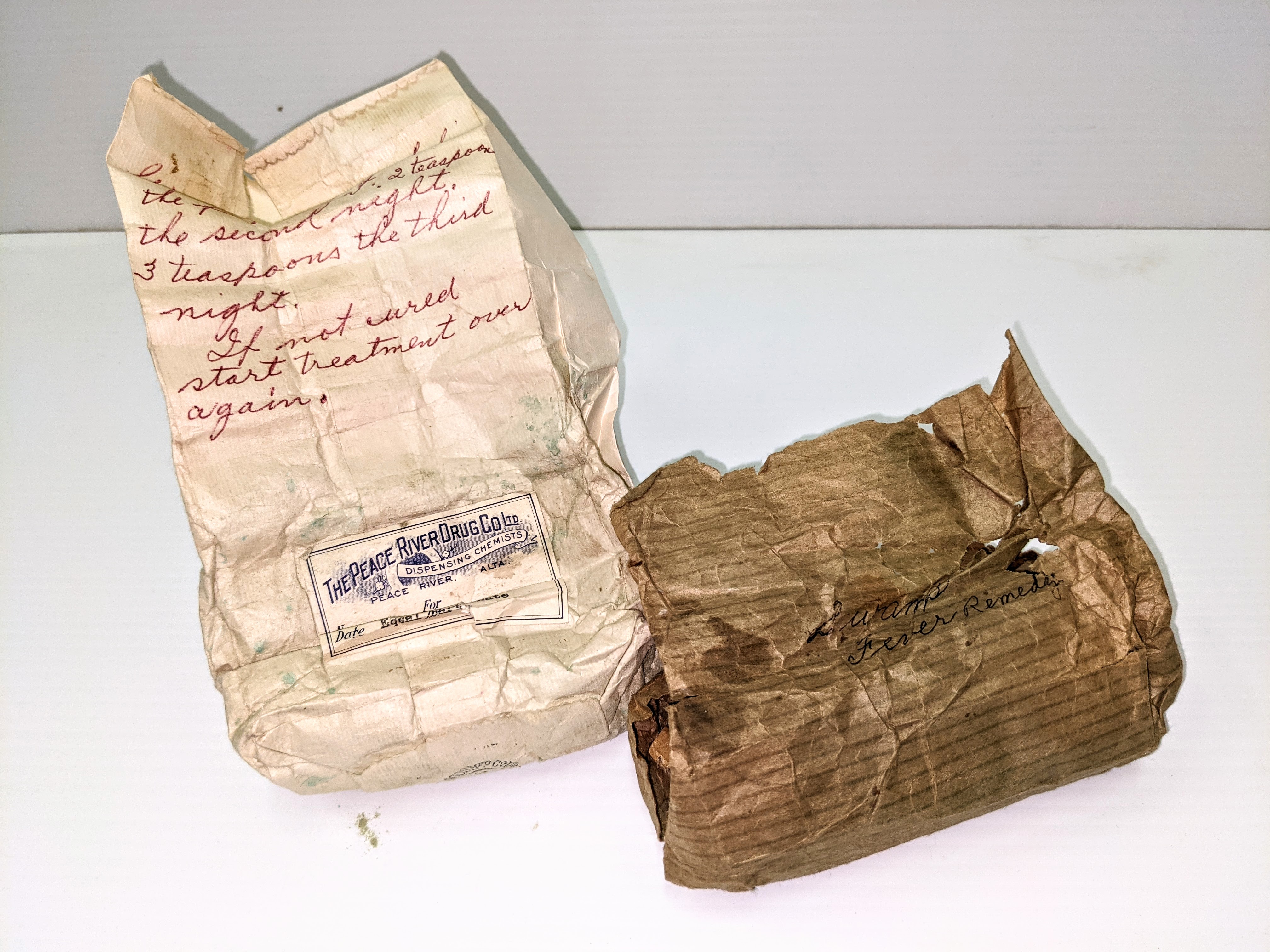 A product of the Peace River Drug Co. This bag contains a fine green powder labelled as "Saltpetre, resin, Borax, and copper sulfate". Scribbled on the brown packaging its use is labelled as "For Swamp Fever" while the red pen dictates the correct dosage. "1 teaspoon the first night, 2 teaspoon the second night, 3 teaspoon the third night. If not cured start treatment over again". Swamp fever is an ailment in horses that causes lethargy, muscle atrophy and anemia - not ideal for indigenous folks and pioneers who relied on horses for transport and heavy work!

14/06/2021
2000.03.54 / Cambell, Jean
