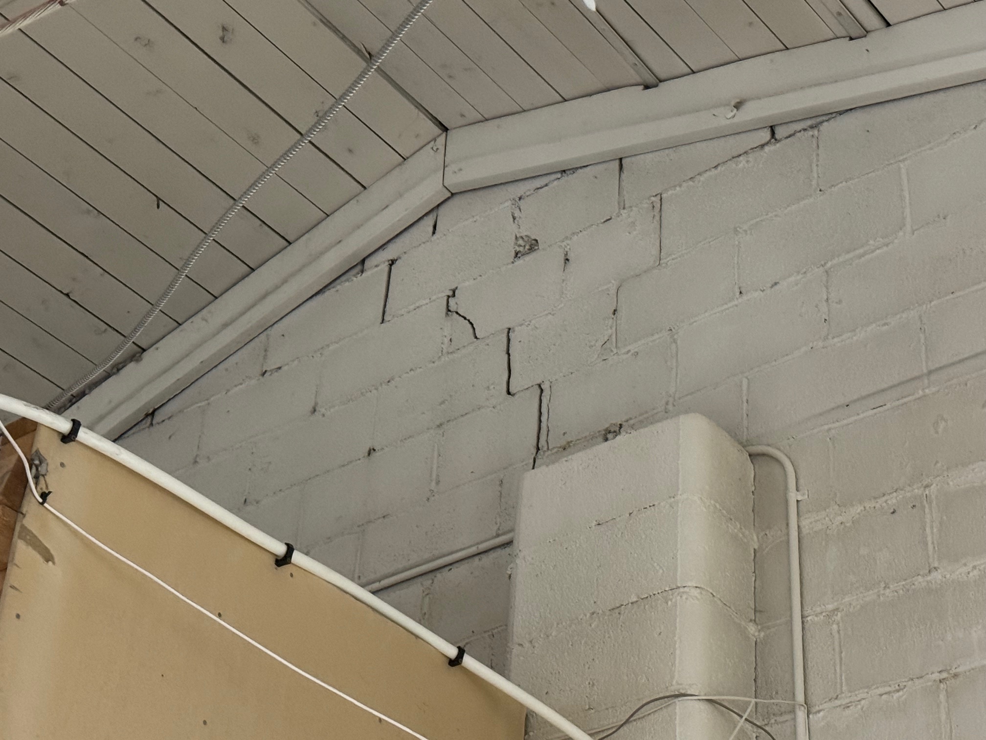 Step cracking  in concrete masonry block wall 