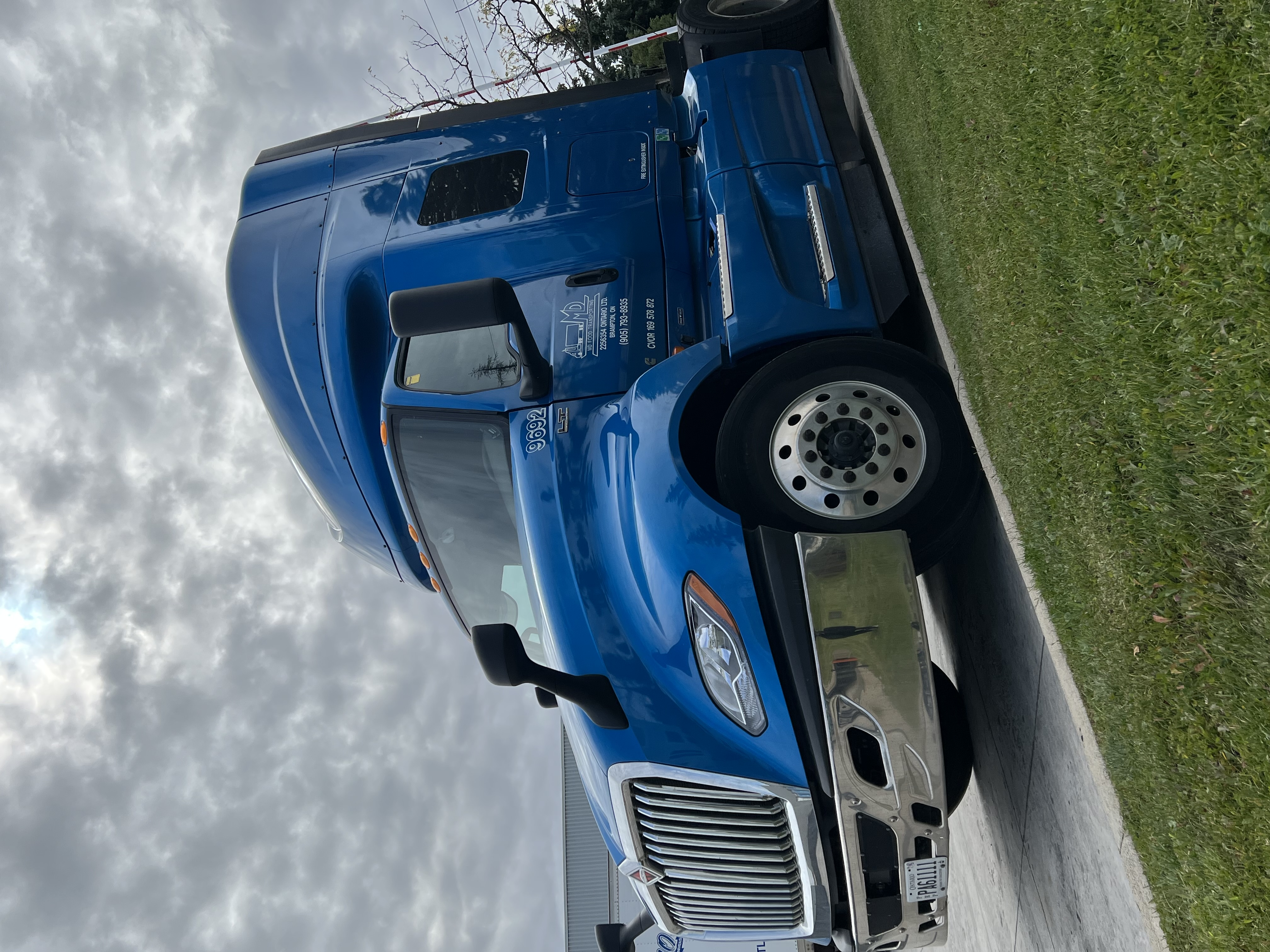 a group of people standing next to a train