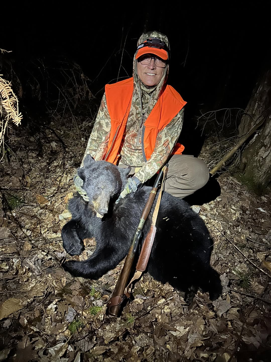 Hunter posing with a black bear at Wild North Outfitters in Ontario.