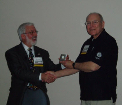 Chapter President-Elect Dwight Scott (R) presents ASHRAE Distinguished Lecturer James Newman with a small gift following his seminars at the MEET Show in May