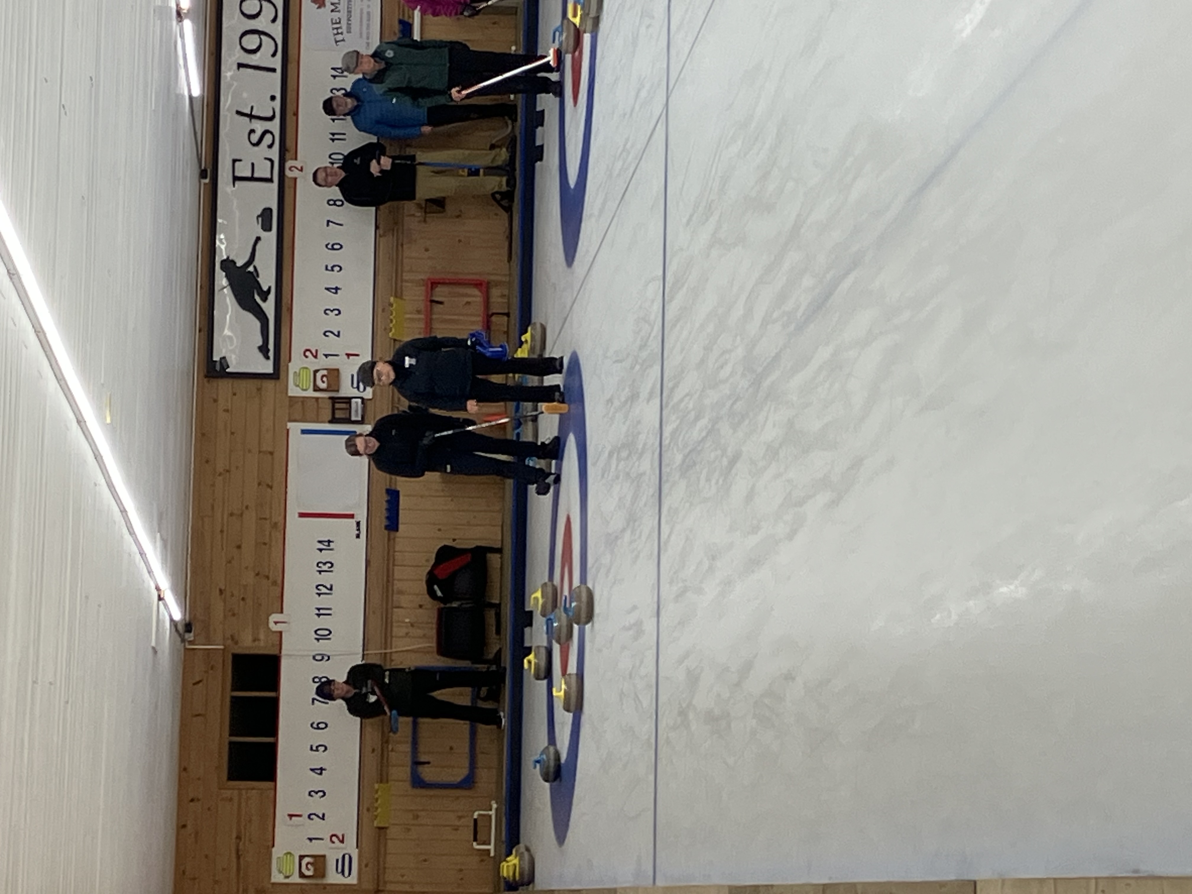 Leona and Catherine discuss broom placement