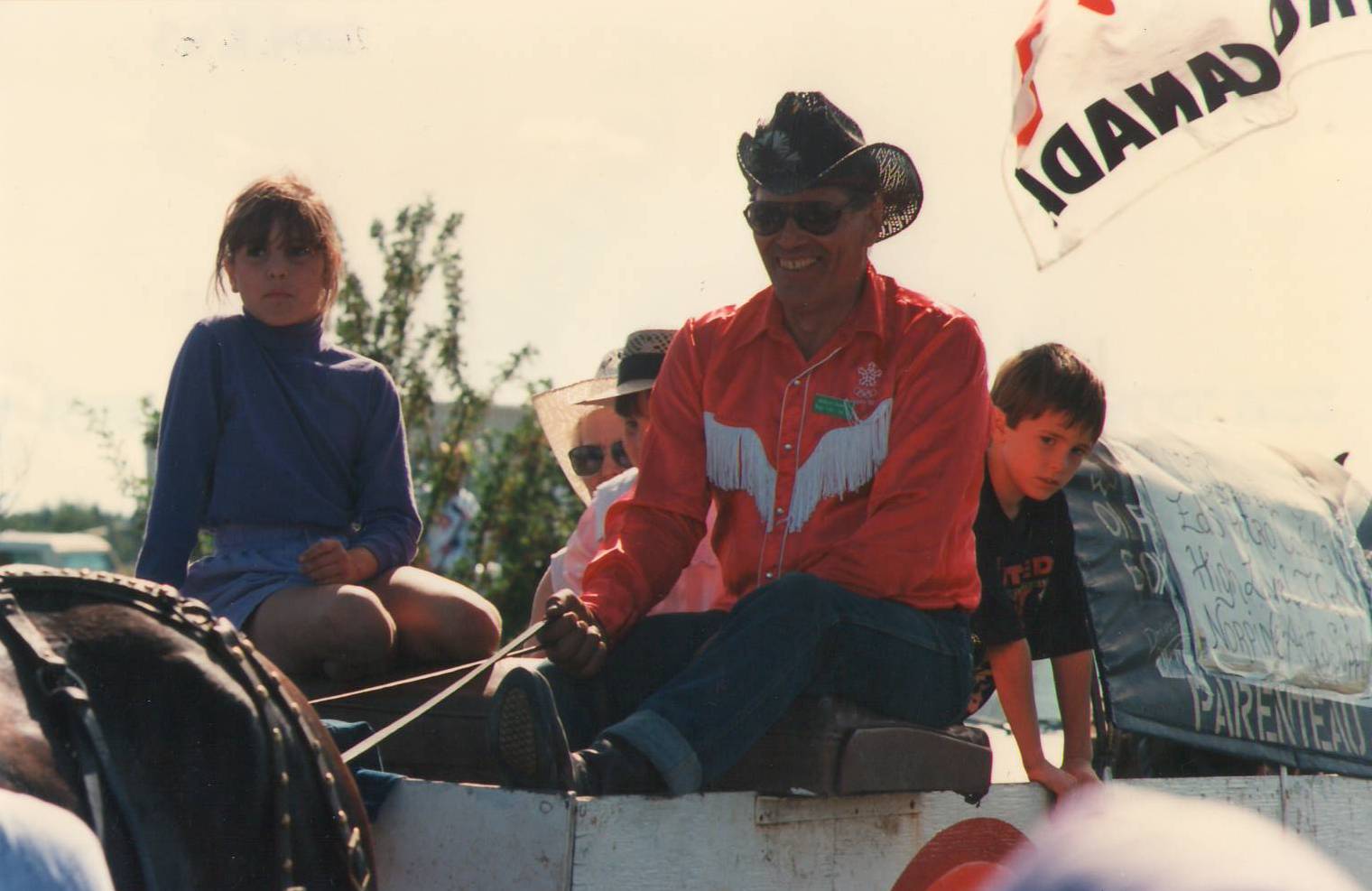 In 1992 a group of Voyageurs retraced the route of Alexander Mackenzie in celebration of Canada's 125th birthday. They came through Fort Vermilion August 16 and the community celebrated with a parade! This photo is one of the drivers and wagons from that parade - but we aren't sure who they are. The name on the side of the Wagon says "Parenteau" but if you have any more information - please let us know!
2004.08.63 / Goldsmith, Claire
--EDIT--
The Driver of this wagon is Eddie Parenteau.