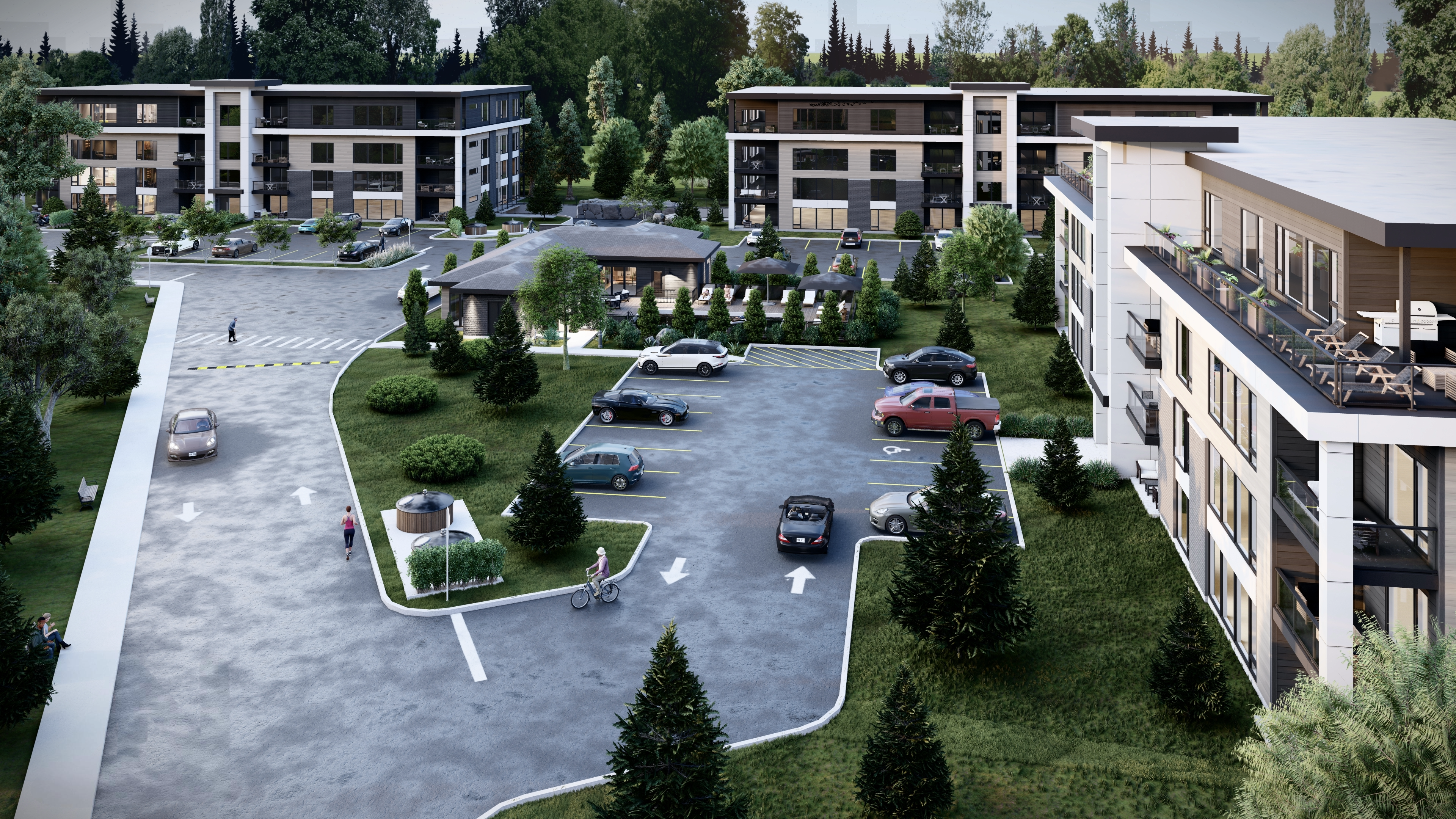 Vue aérienne du projet Watson Square à Lachute – milieu de vie haut de gamme avec pavillon piscine, espaces communs et bâtiments locatifs intégrés à la nature