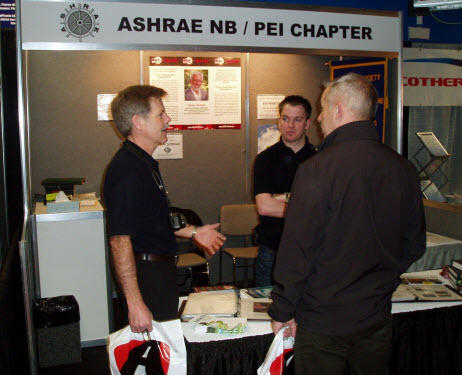 Chapter Executive members John Willden (L) and Kevin Leger (C) man the ASHRAE booth at the MEET Show