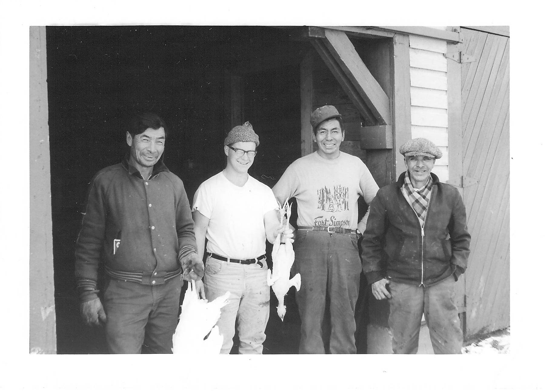 These 4 are seemingly in the middle of butchering chickens at Fort Simpson. There was an experimental farm there that some of the staff from Fort Vermilion went to visit - this (and a few other pictures) come from that trip. The Farm operated from 1947 -1968 and you can read more about it here - https://publications.gc.ca/.../aac-aafc/A51-135-1953-eng.pdf
Let us know if you recognize any of these gentleman. Fort Vermilion Experimental Farm / 2010.80.894