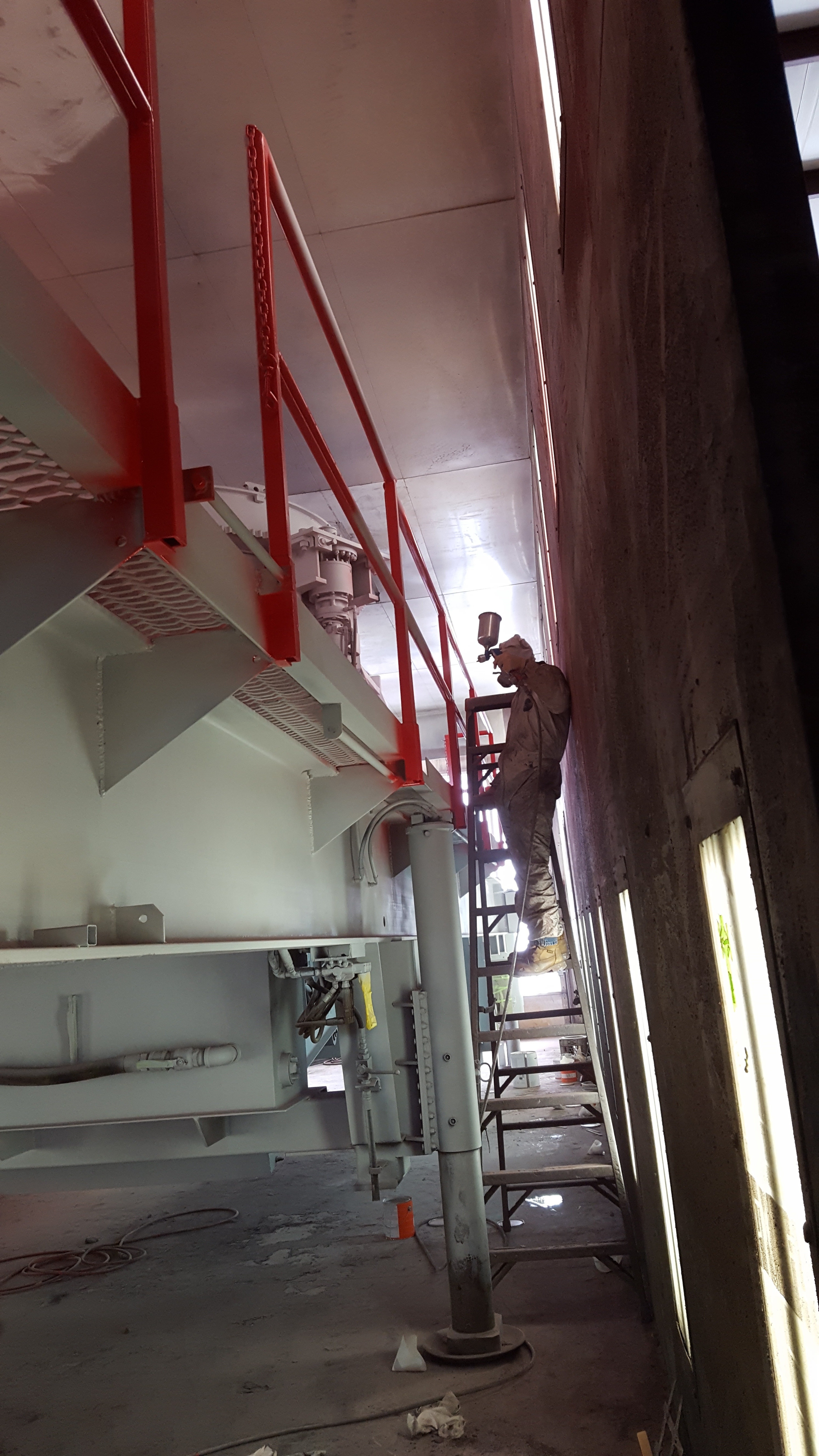 Spraying the handrails red.