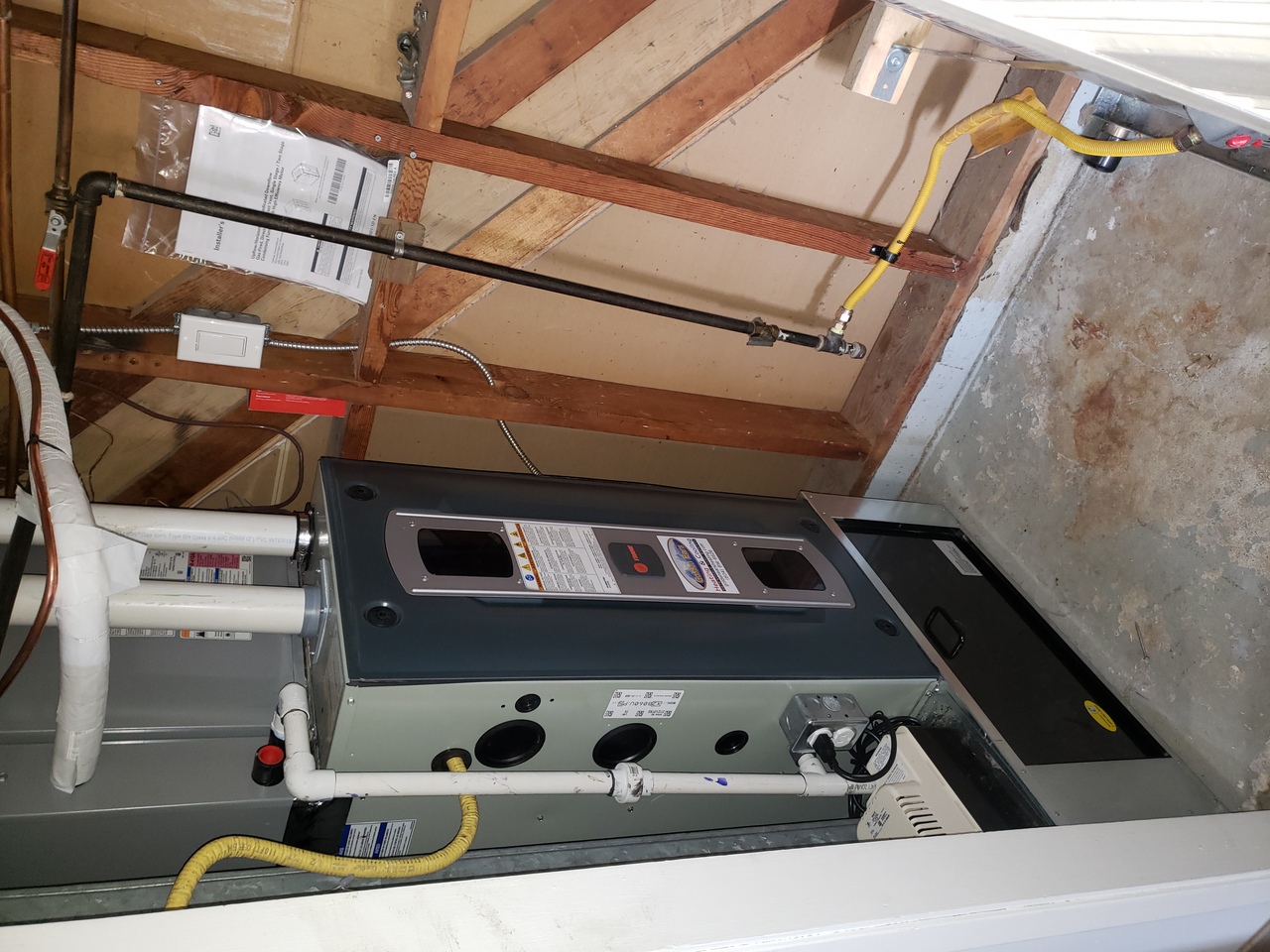 A man wearing a blue uniform and cap opening a glass door of a commercial refrigerator in a store, with various products displayed inside. A man wearing a blue uniform and cap opening a glass door of a commercial refrigerator in a store, with various products displayed inside.