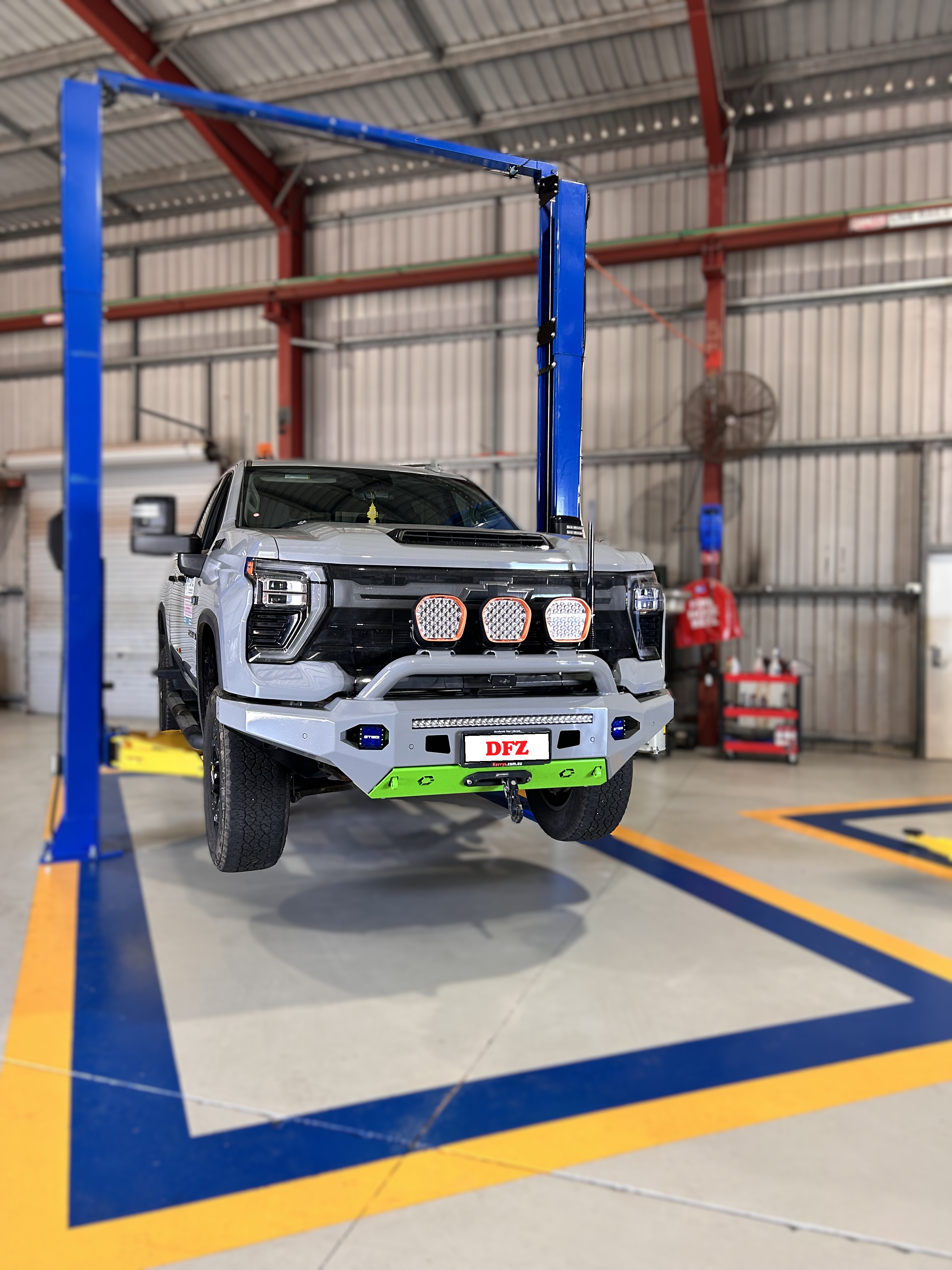 Chevrolet Silverado on a Certified Vehicle Hoist Being Serviced Chevrolet Silverado on a Certified Vehicle Hoist Being Serviced