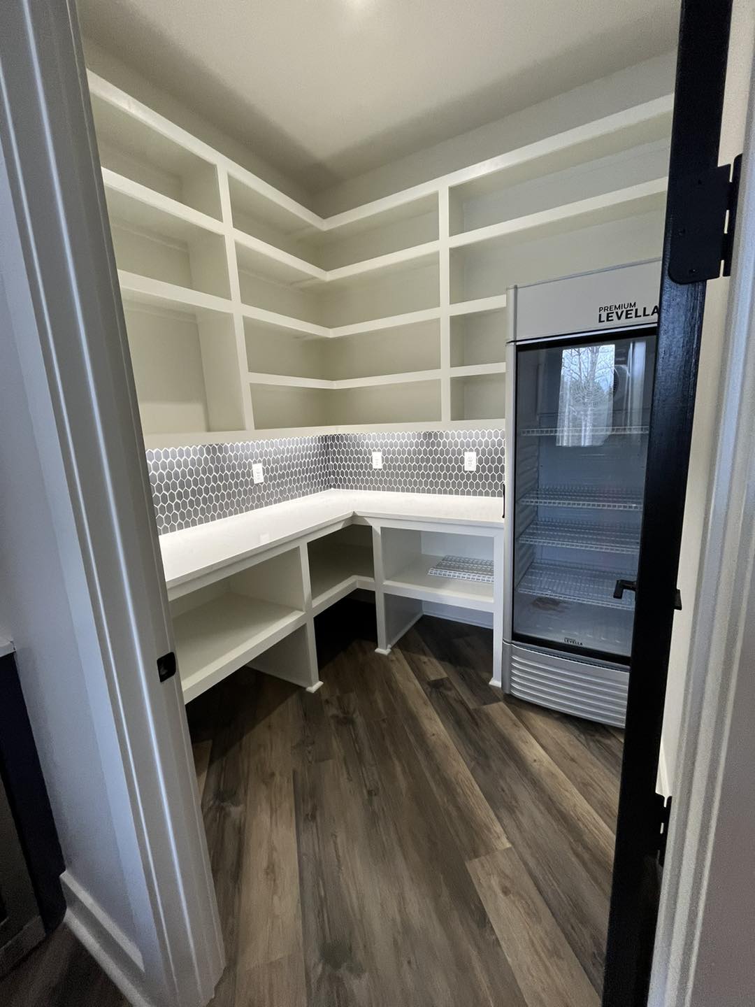 Walk-In Pantry with Built-In Shelving and Beverage Cooler