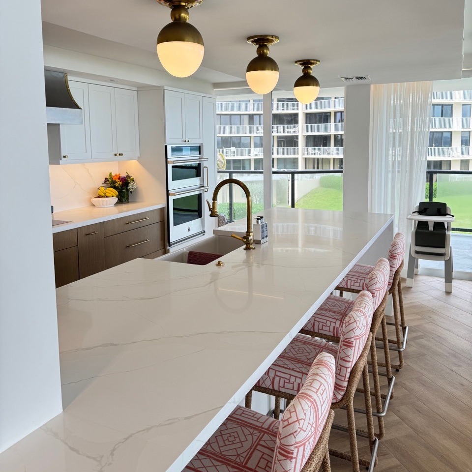 Modern Kitchen with Marble Island and Gold Fixtures