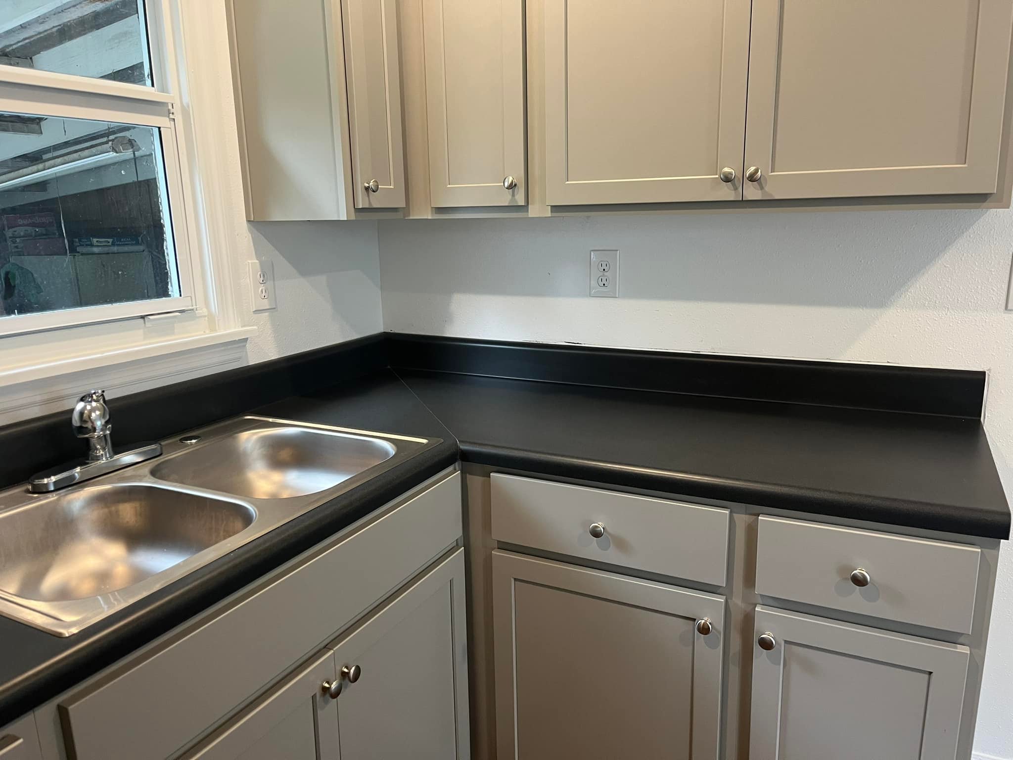 Kitchen restored following post-renovation recovery with surfaces cleaned and prepared for occupancy