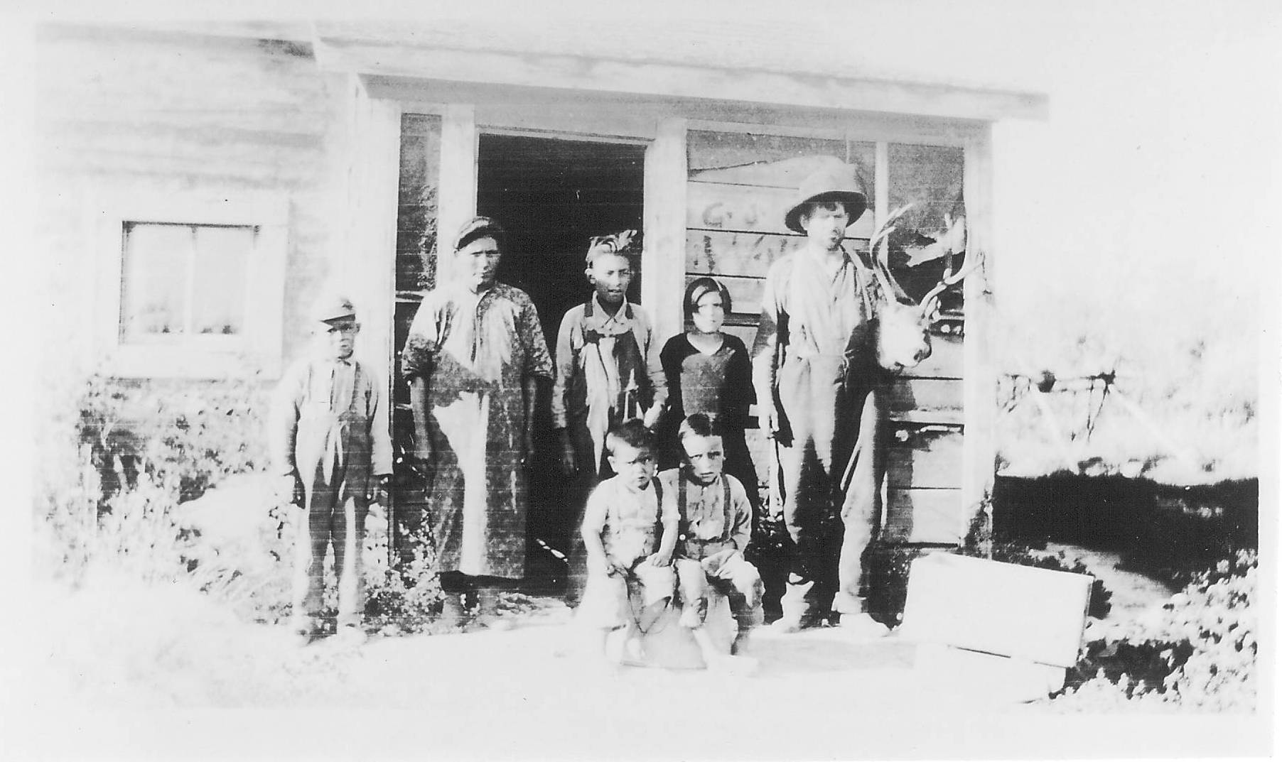 This photograph is labelled as "Family in front of Cabin" clearly there is a bit more to the picture considering the twins sitting in front and the sizeable deer head that the person on the right is casually holding! If you recognize anyone please let us know!

990.4.1.47 
Ardley, Mary