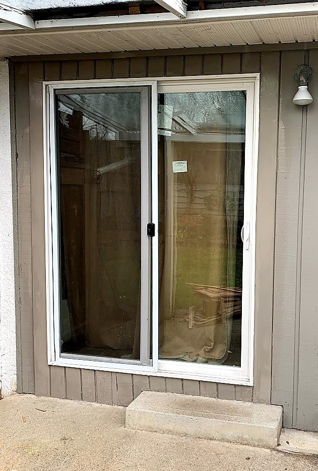 New tempered glass energy efficient patio door and screen installed.