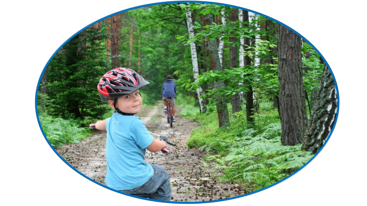 Boy on bike in woods