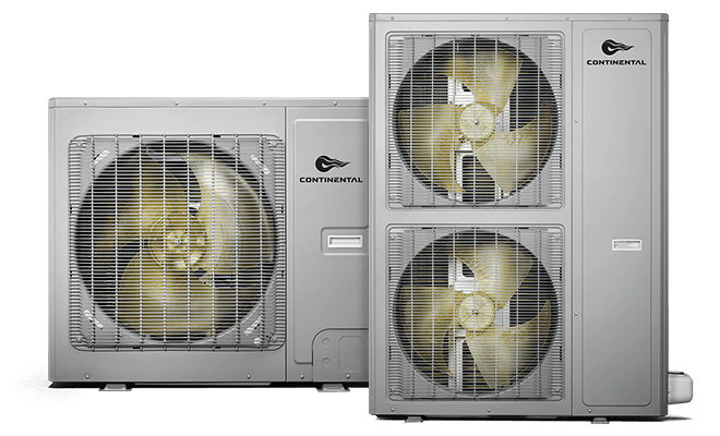 Outdoor air conditioning unit beside house in lush green landscape with mountains in the background.