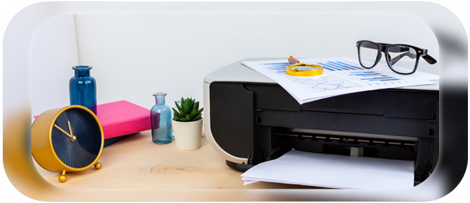 A black printer with glasses sitting on it