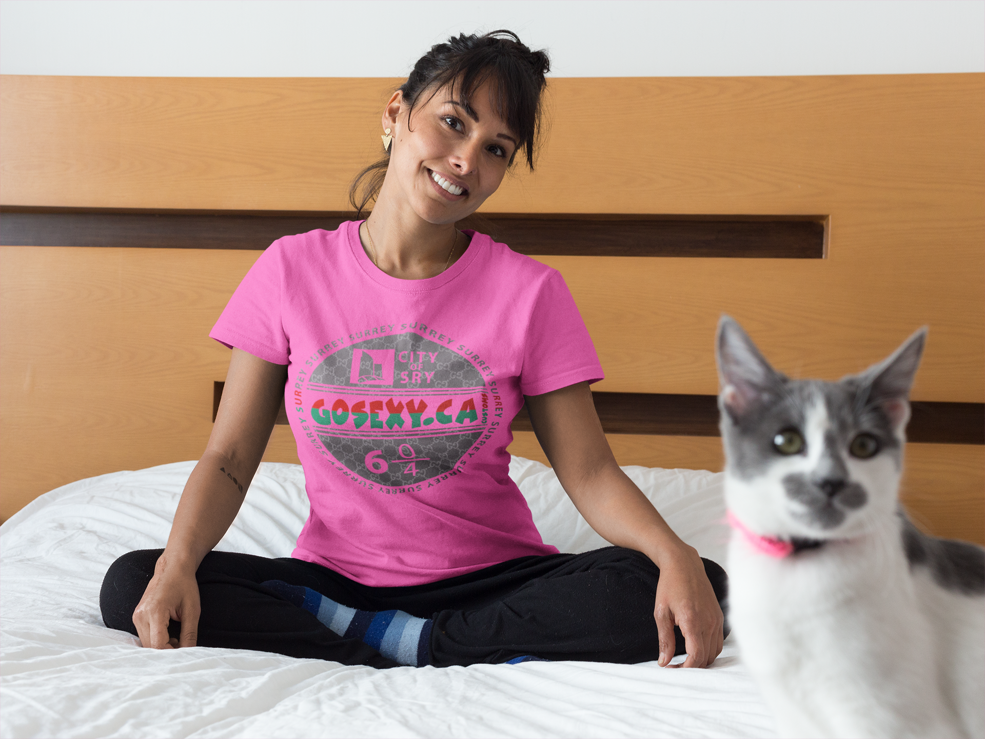 https://0901.nccdn.net/4_2/000/000/038/2d3/happy-woman-wearing-a-t-shirt-on-bed-with-her-cat-gosexyca.png