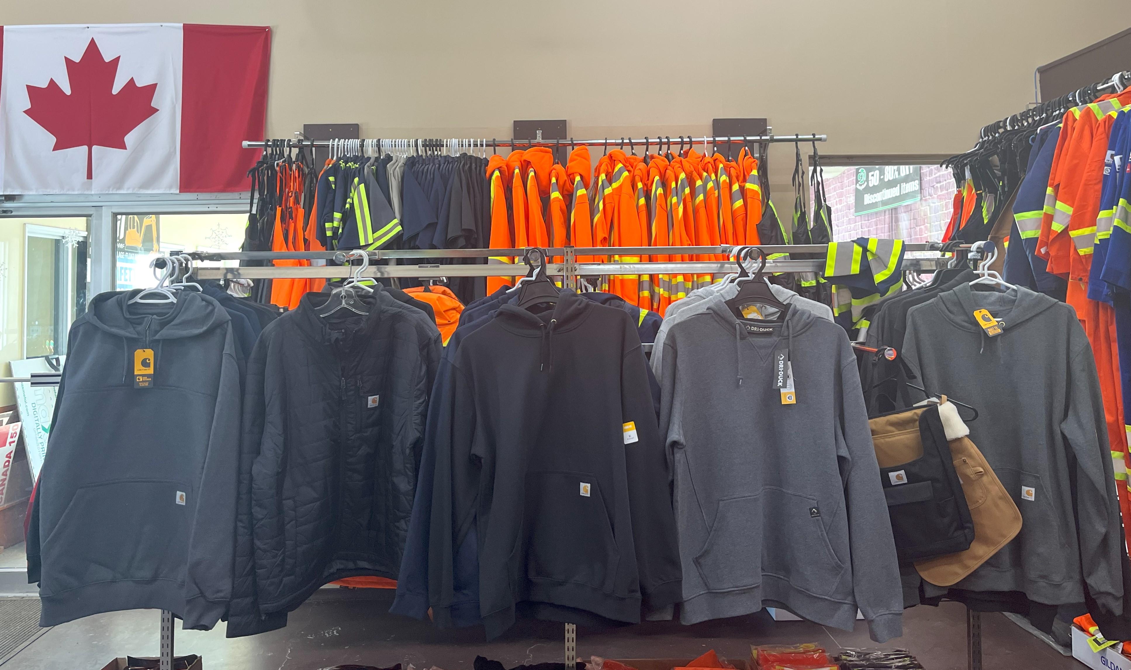 A rack of carhartt hoodies 