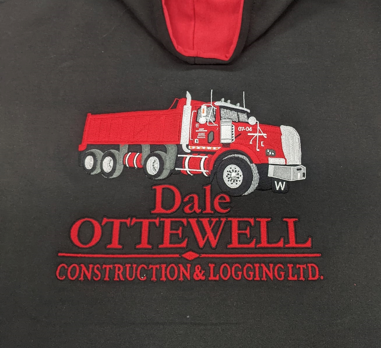 Sweater with a large embroidered vehicle 